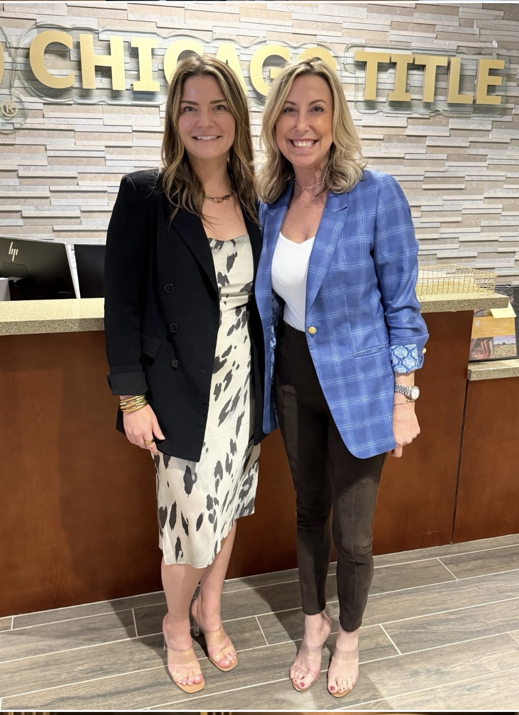 Tamara Mannen with a colleague at a Chicago Title office in the Austin market